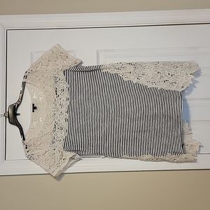 Hannah tunic style top.  Black and cream striped.  Size medium